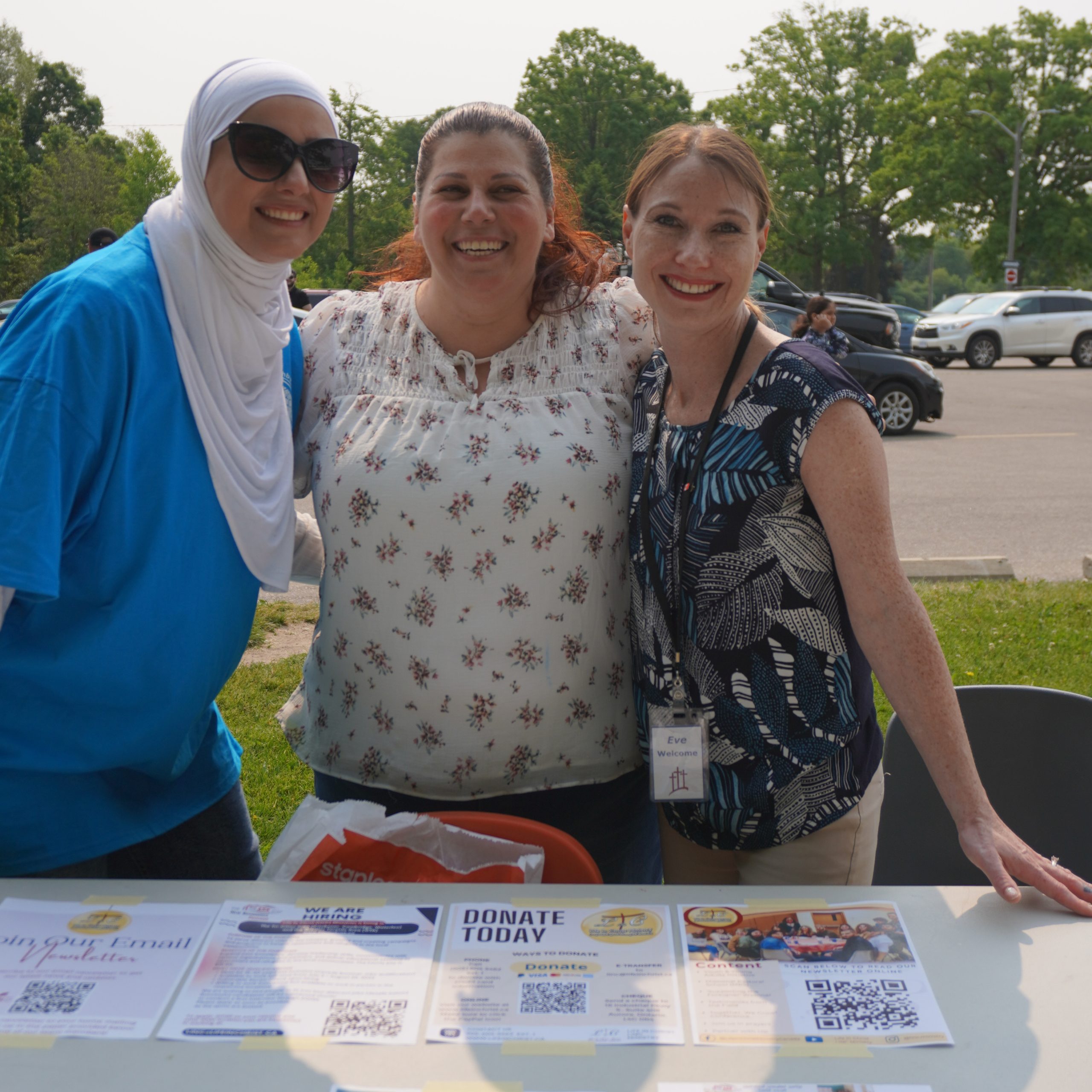 3 woman by table fundraising