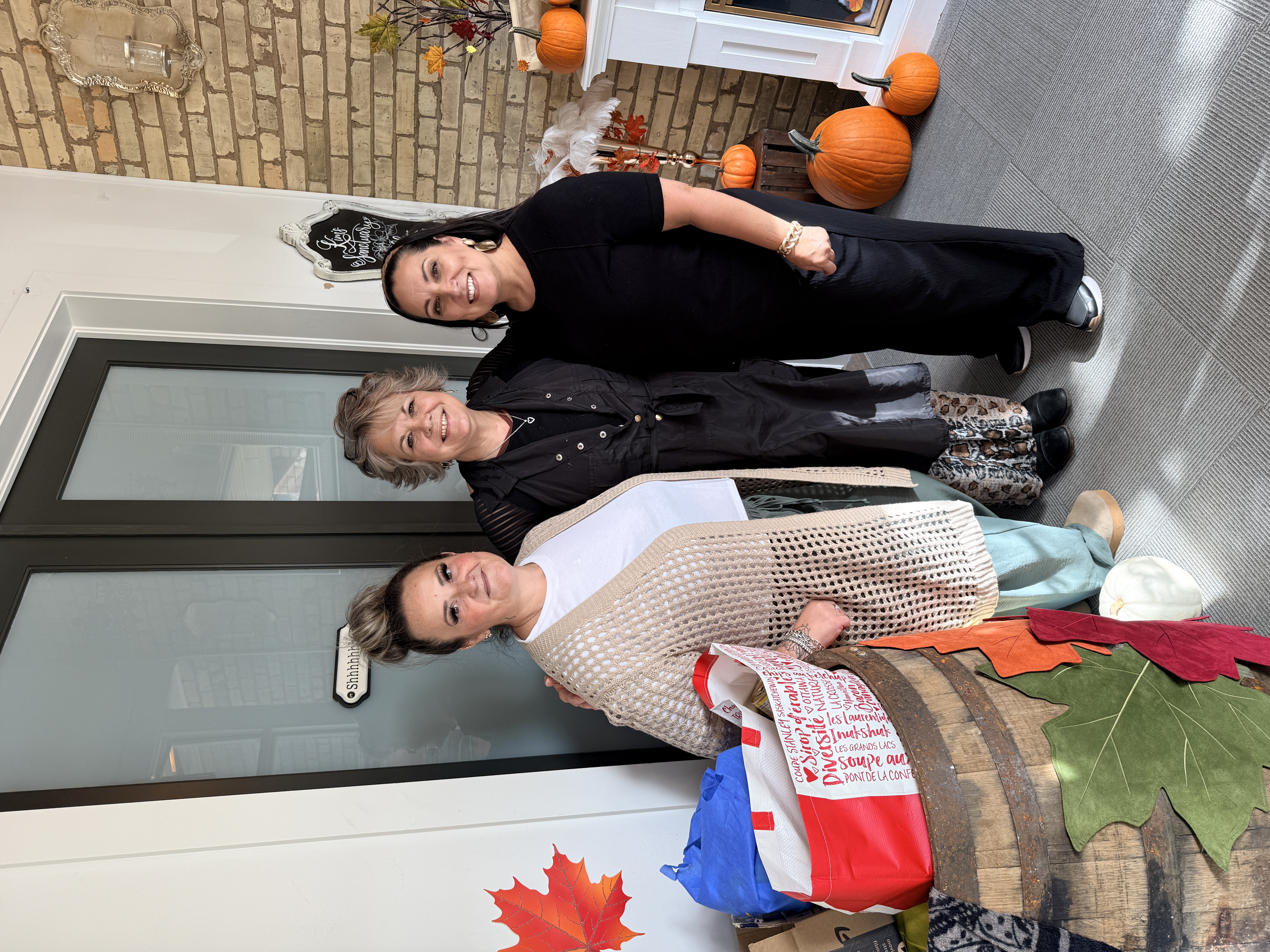 3 woman by table fundraising